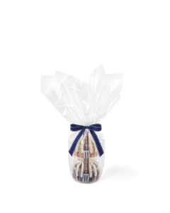 Two personal-size bundt cakes stacked vertically, packaged in a plastic container and gift-wrapped in cellophane. 