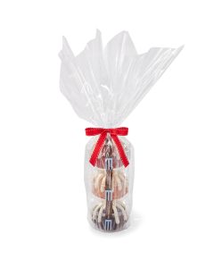 Three personal-size bundt cakes stacked vertically, packaged in a plastic container and gift-wrapped in cellophane. 