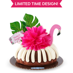 Party in Paradise Bundt Cake with a flamingo and tropical leaf decoration and hot pink bow. 