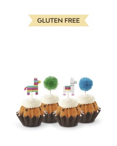 Cupcake like bundt cakes with frosting and decorated with party pinatas and poms. 