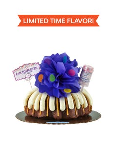 Limited time flavor! Decorated bundt cake covered with frosting. Decoration includes a purple bow with confetti sprinkles and a confetti popper with a card that says Celebrate and cue the confetti. 