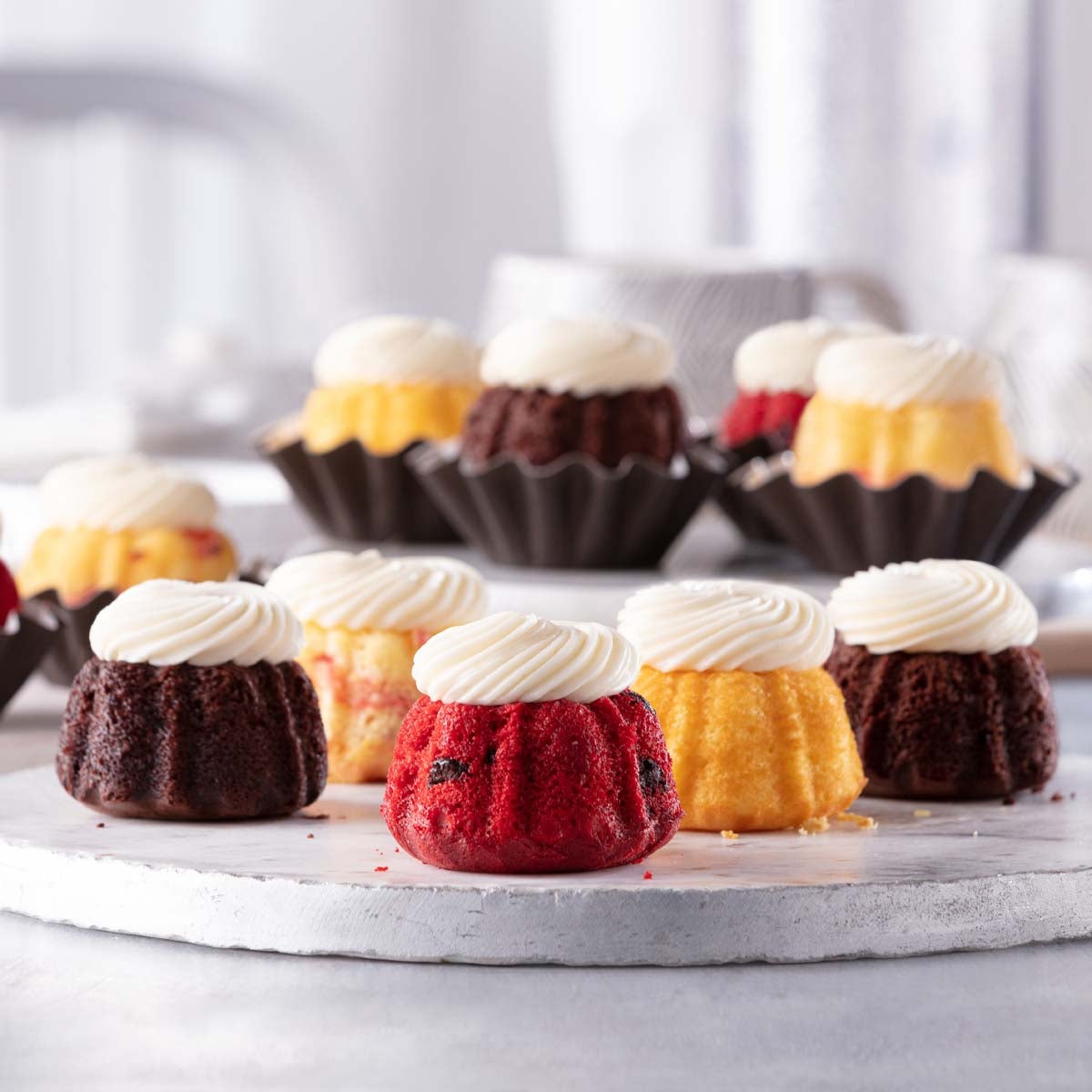 A signature blend of Bundtinis® including Lemon, Chocolate Chocolate Chip, Red Velvet and White Chocolate Raspberry.