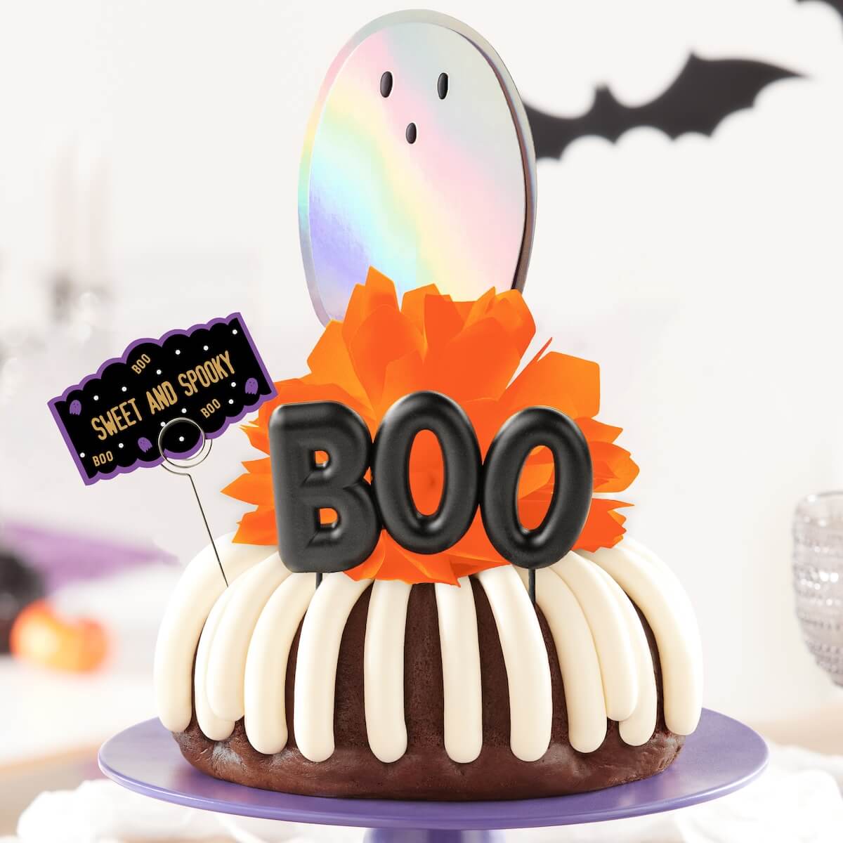 Chocolate Chocolate Chip Bundt Cake with holographic ghost deco, 3D "BOO" deco, orange bow, with a "Sweet and Spooky" quote card