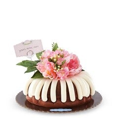 Bundt Cake with signature frosting and pink flower